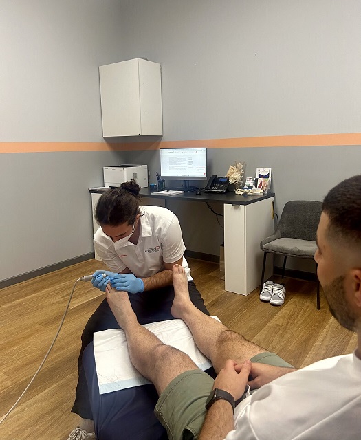 Patient receiving podiatry Woodville treatment from a skilled podiatrist providing foot care, pain relief, orthotic support, and podiatric care for plantar fasciitis, bunions, heel pain, sports injuries, ingrown toenail, warts, and feet conditions.